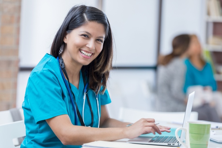 A nurse with a smile is giving an exam at the rehabilitation center in Bossier City, LA