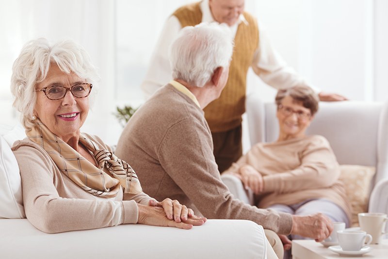 A group of seniors is having tea inside a home in Bossier City, LA
