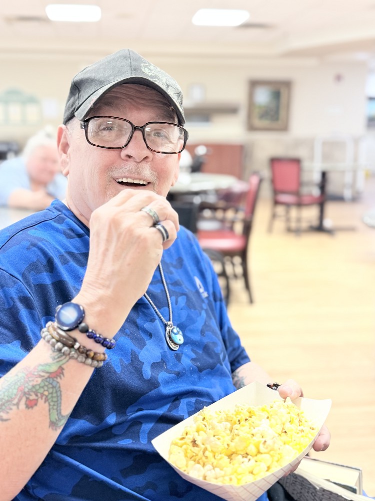 male patient eating popcorn