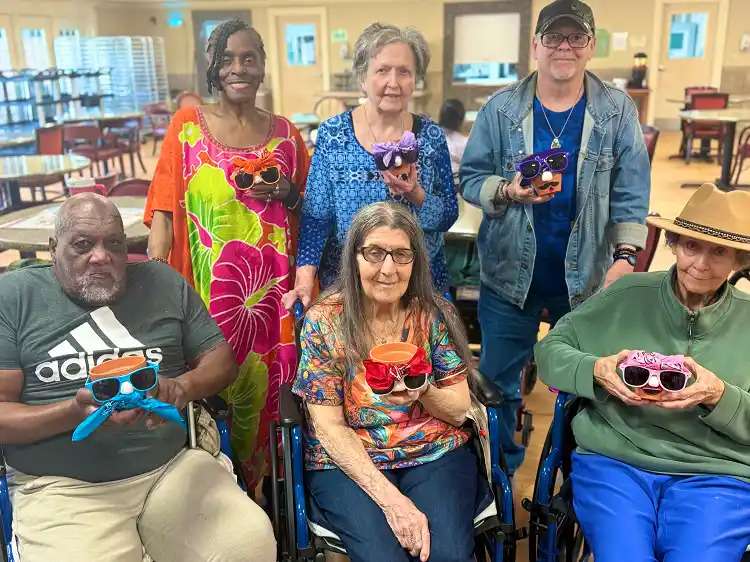 A group of patients showing the crafts they made at a nursing home in Bossier City, LA
