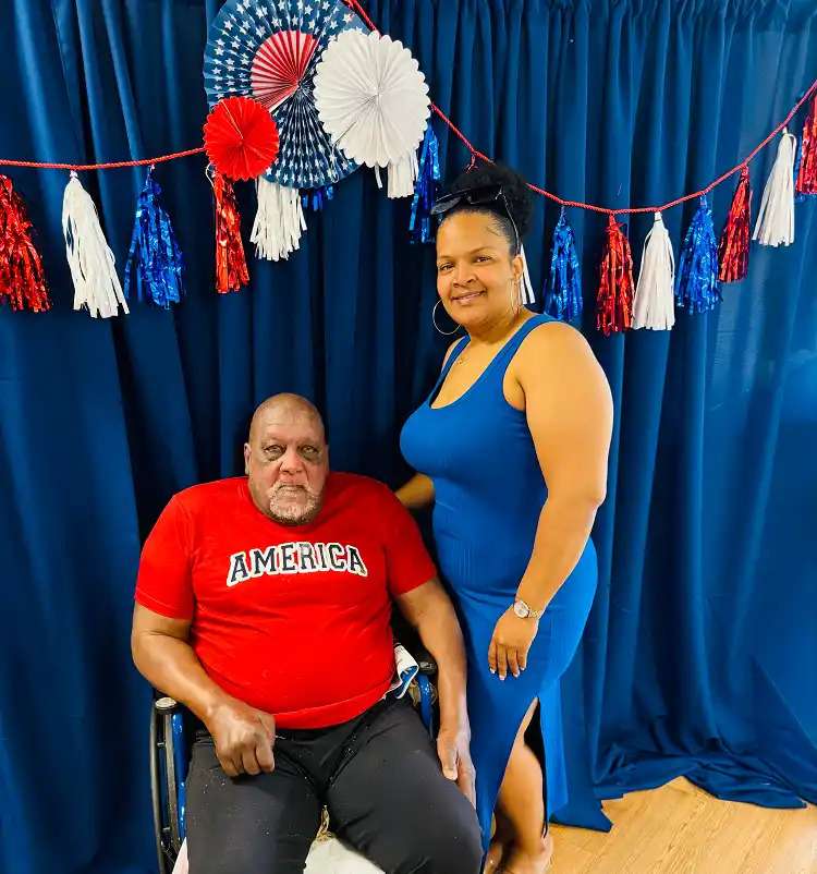 A male patient with his family posing for a picture at a nursing home in Bossier City, LA