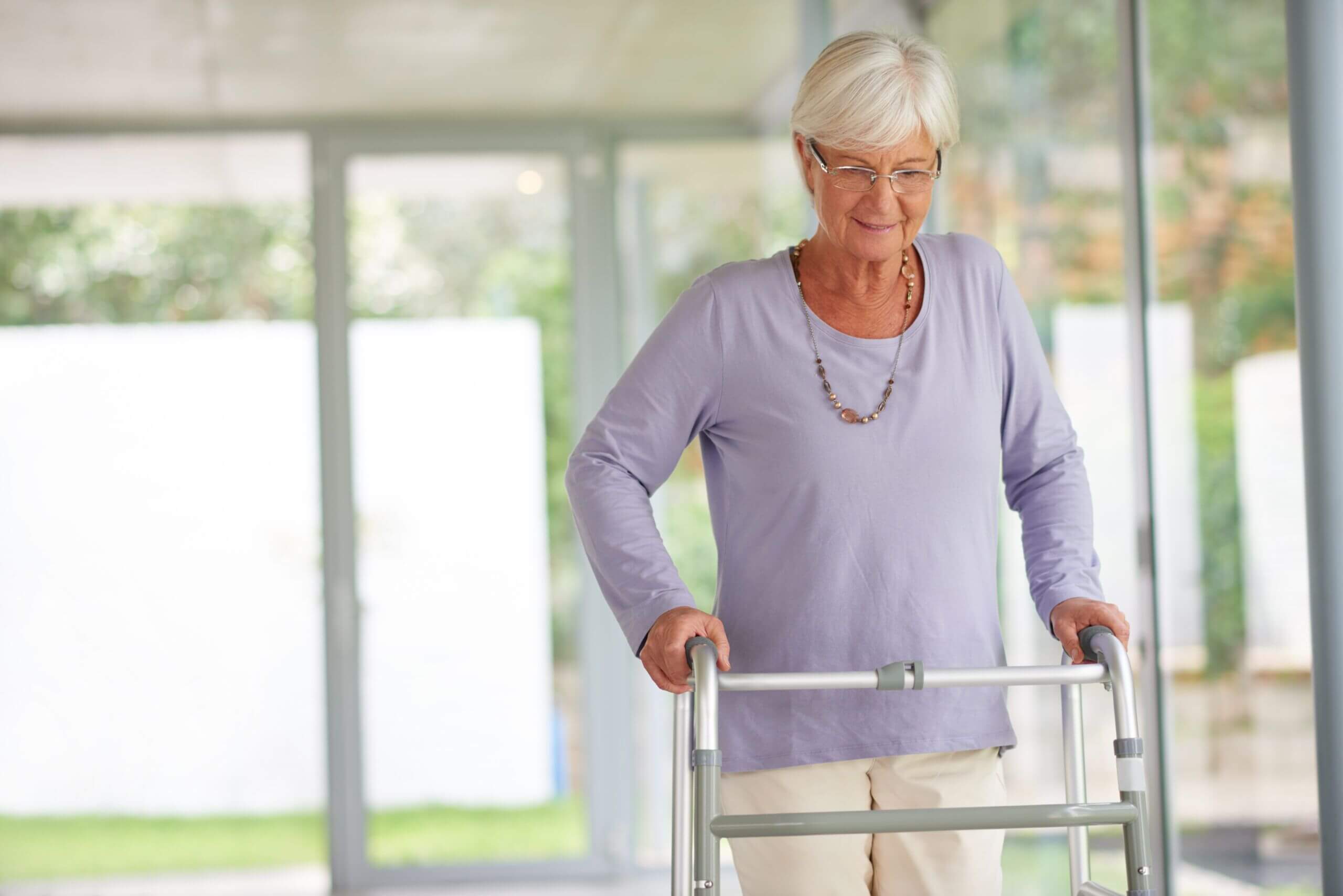 Elderly woman using a walker for Post-Surgery Care and mobility support in Bossier City, LA