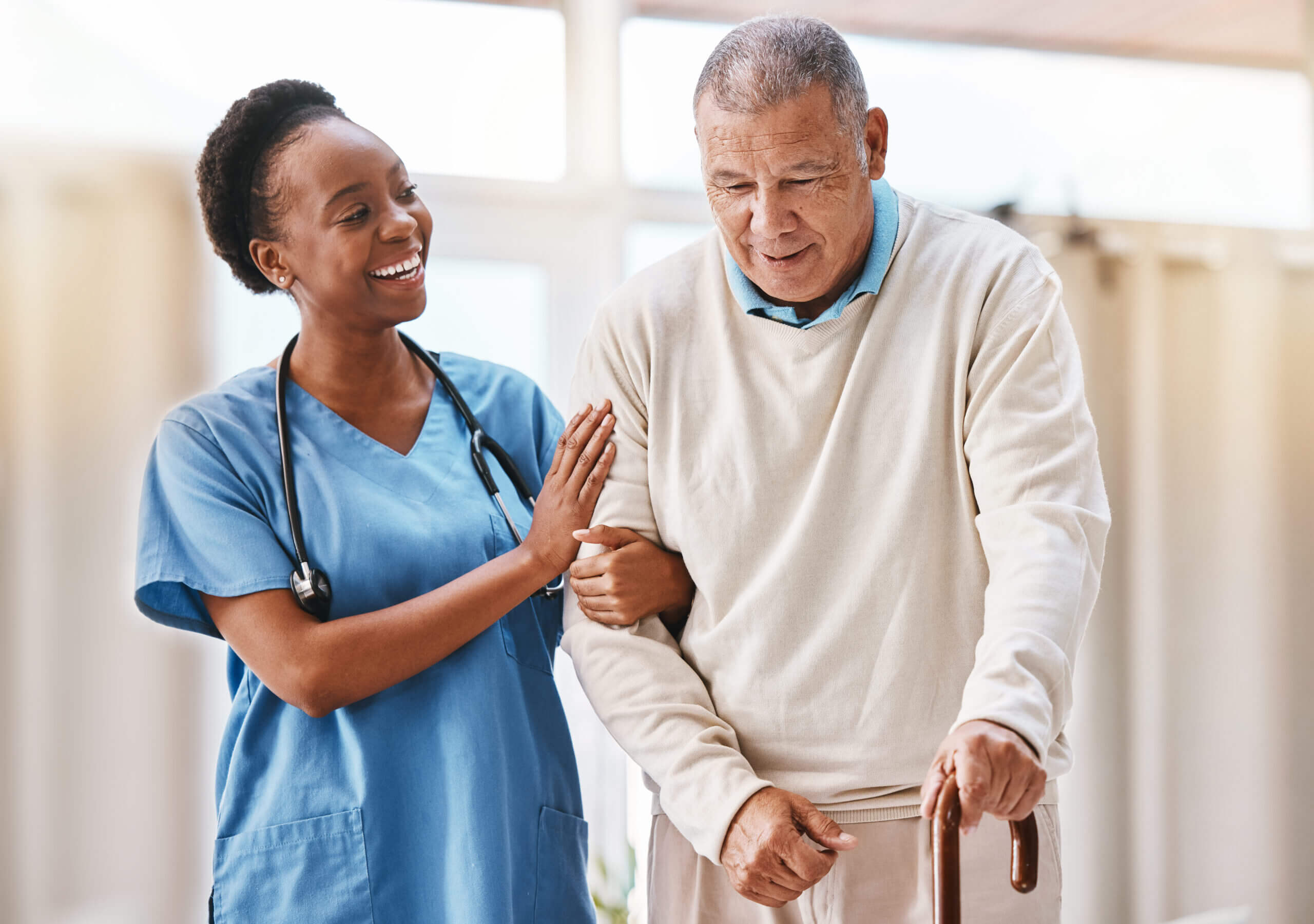 A nurse assists an elderly man during stroke recovery rehabilitation in Bossier City, LA