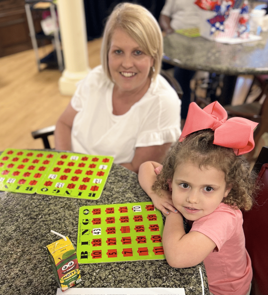 Resident visiting with a young child at Colonial Oaks Skilled Nursing in Bossier City, LA