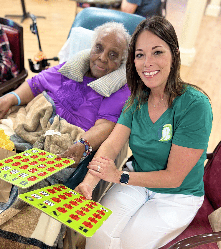 Resident with a caring staff member at Colonial Oaks in Bossier City, LA