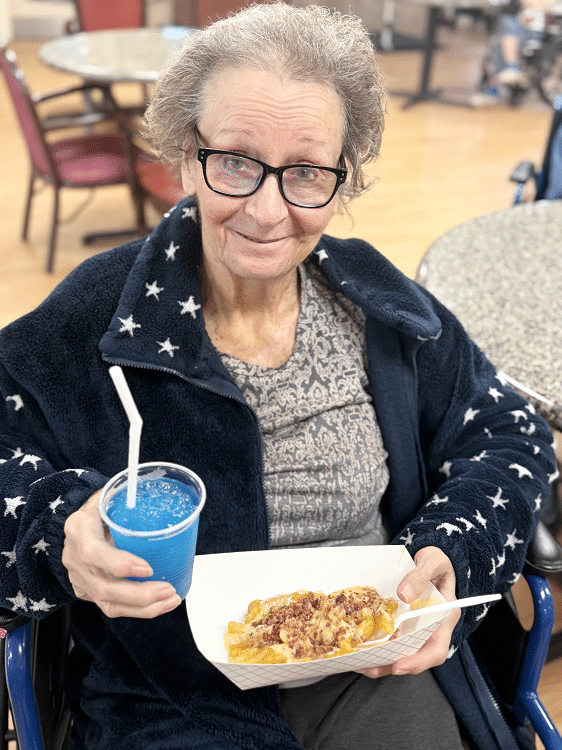 Resident enjoying a favorite meal at Colonial Oaks Skilled Nursing in Bossier City, LA