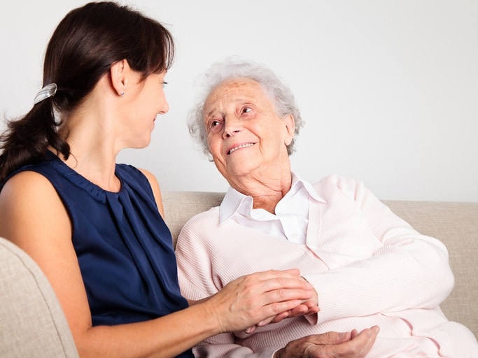 Senior woman with her caregiver in dementia care